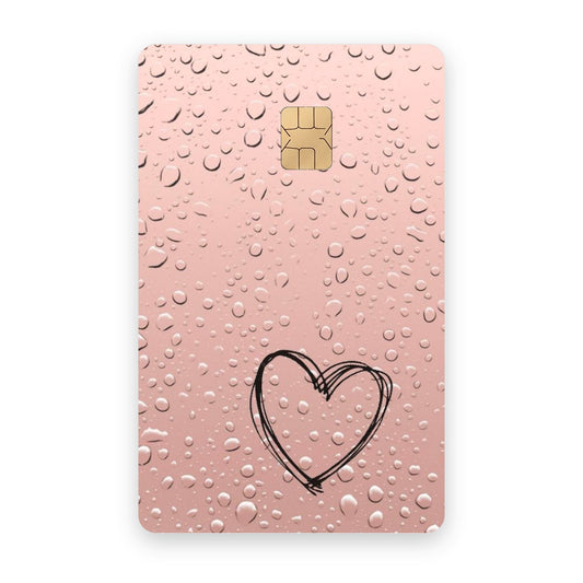Dropping Heart card sticker on a bank card
