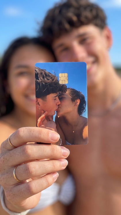 A personalized card sticker held up