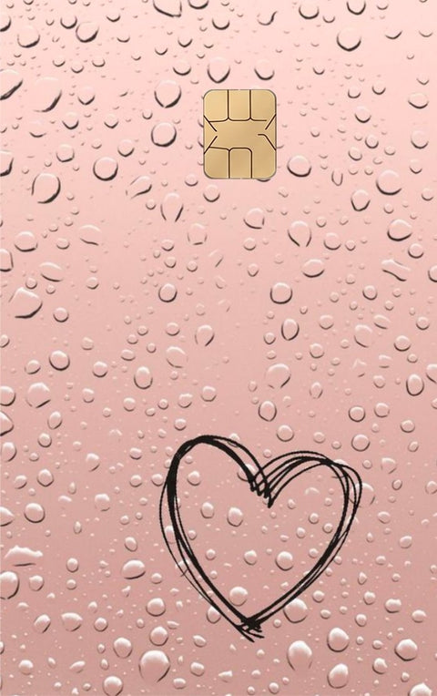 Dropping Heart card sticker on a bank card
